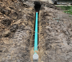 Clogged drain or sewer line problem showing new underground sewer pipe installation by Flow Pro Plumbing and Drain Cleaning.