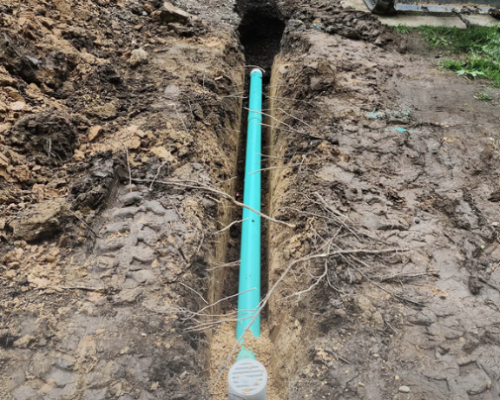 Clogged drain or sewer line problem showing new underground sewer pipe installation by Flow Pro Plumbing and Drain Cleaning.